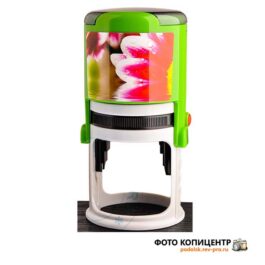 Зелёная круглая оснастка печати с розовым рисунком